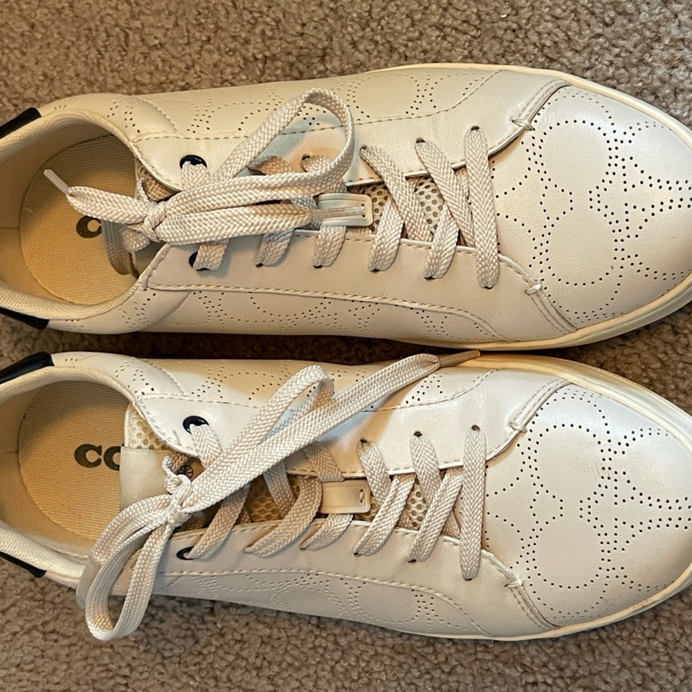 Size 10 woman’s Coach tennis shoes.